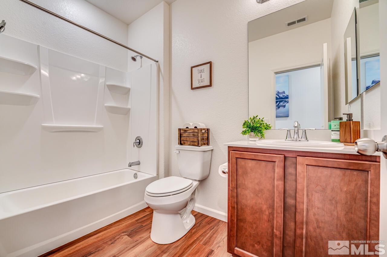 9344 Bay Reno, NV 89506 - Photo 28 of 31 a bathroom with a sink a toilet and shower