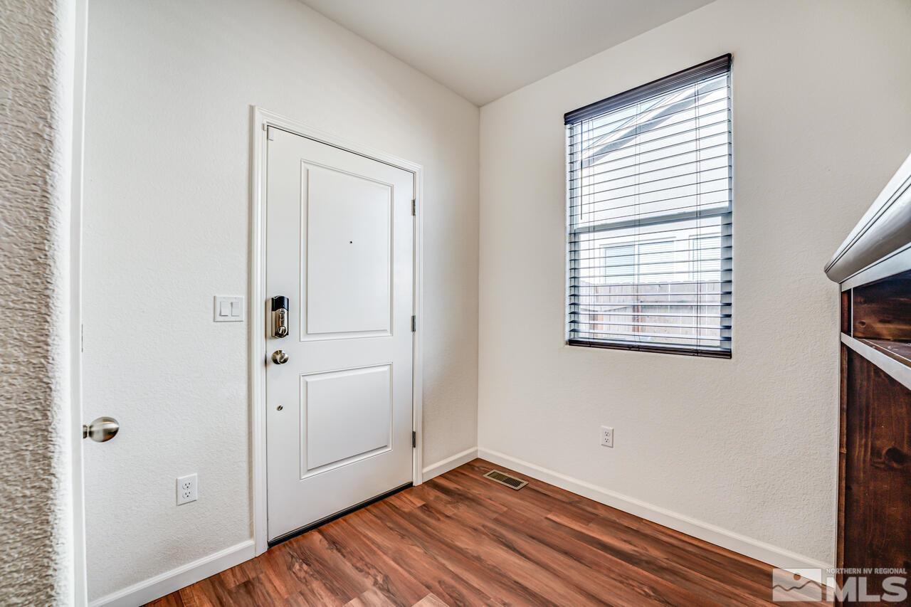 9344 Bay Reno, NV 89506 - Photo 8 of 31 an empty room with wooden floor and windows