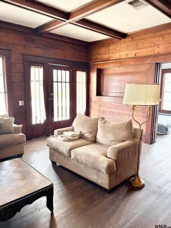 a living room with furniture and a large window