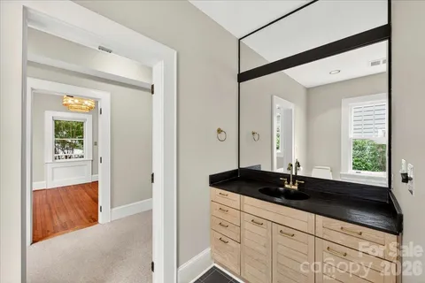 a bathroom with a double vanity sink and a bathtub
