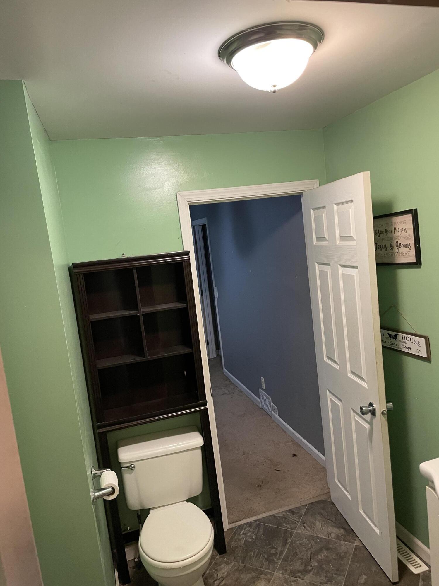 306 North Main Street Morocco, IN 47963 - Photo 5 of 12 a bathroom with a toilet and a shower