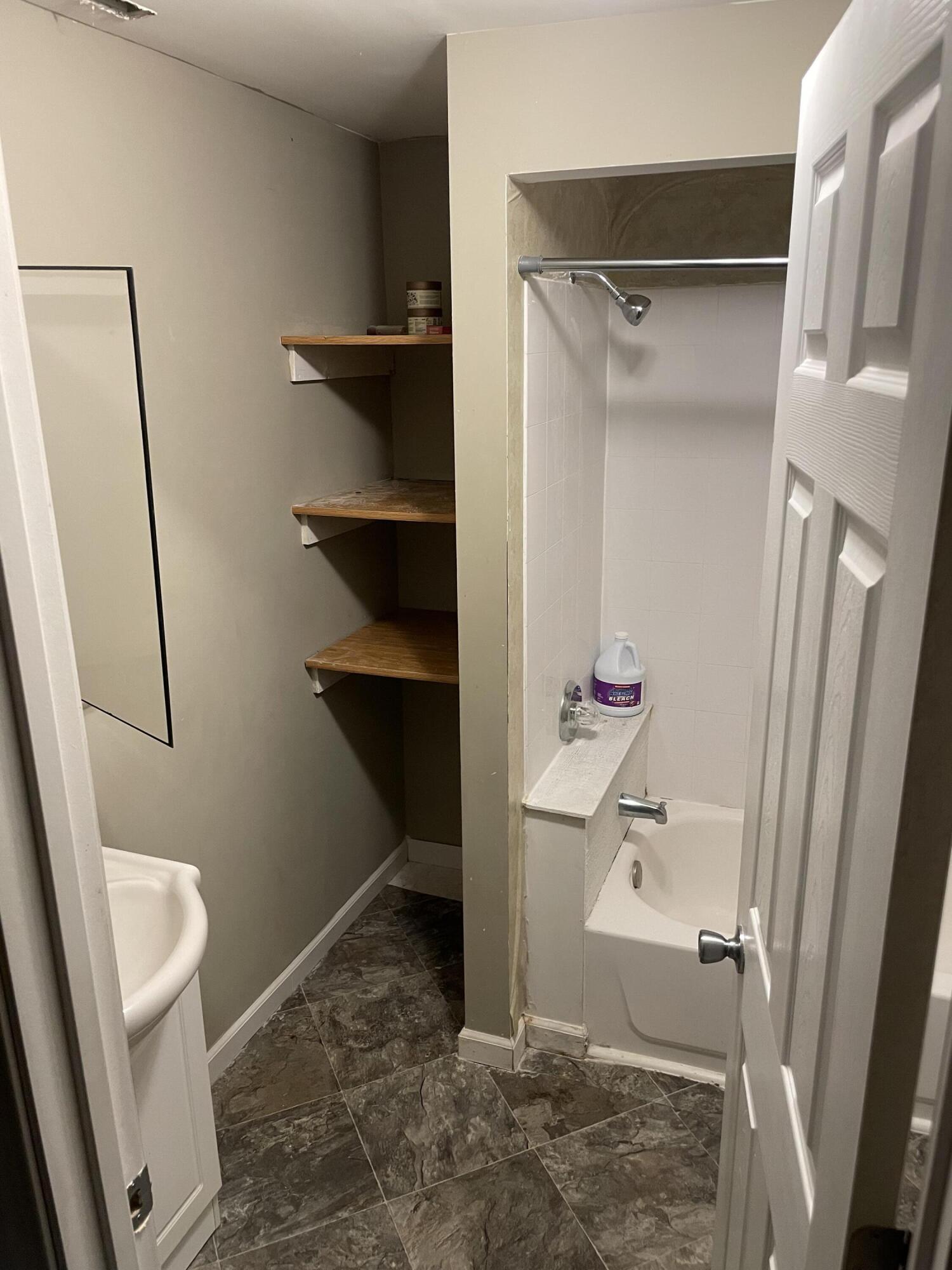 306 North Main Street Morocco, IN 47963 - Photo 10 of 12 a bathroom with a sink and a mirror