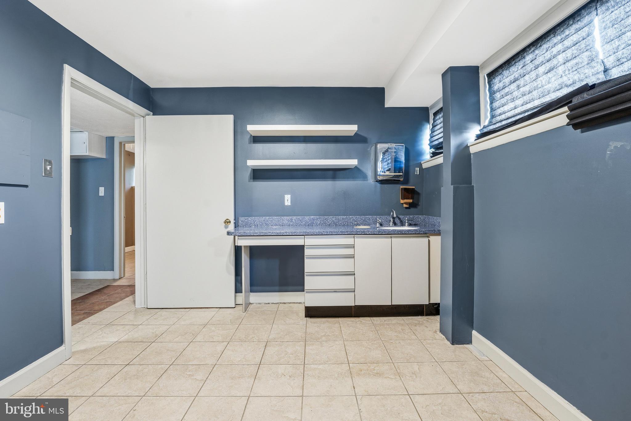 700 Greyrock Drive Silver Spring, MD 20910 - Photo 32 of 48 a kitchen with a stove and a refrigerator