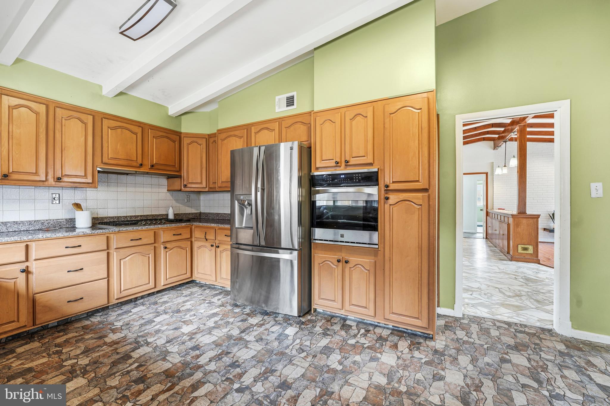 700 Greyrock Drive Silver Spring, MD 20910 - Photo 10 of 48 a kitchen with stainless steel appliances granite countertop a refrigerator a stove and a sink