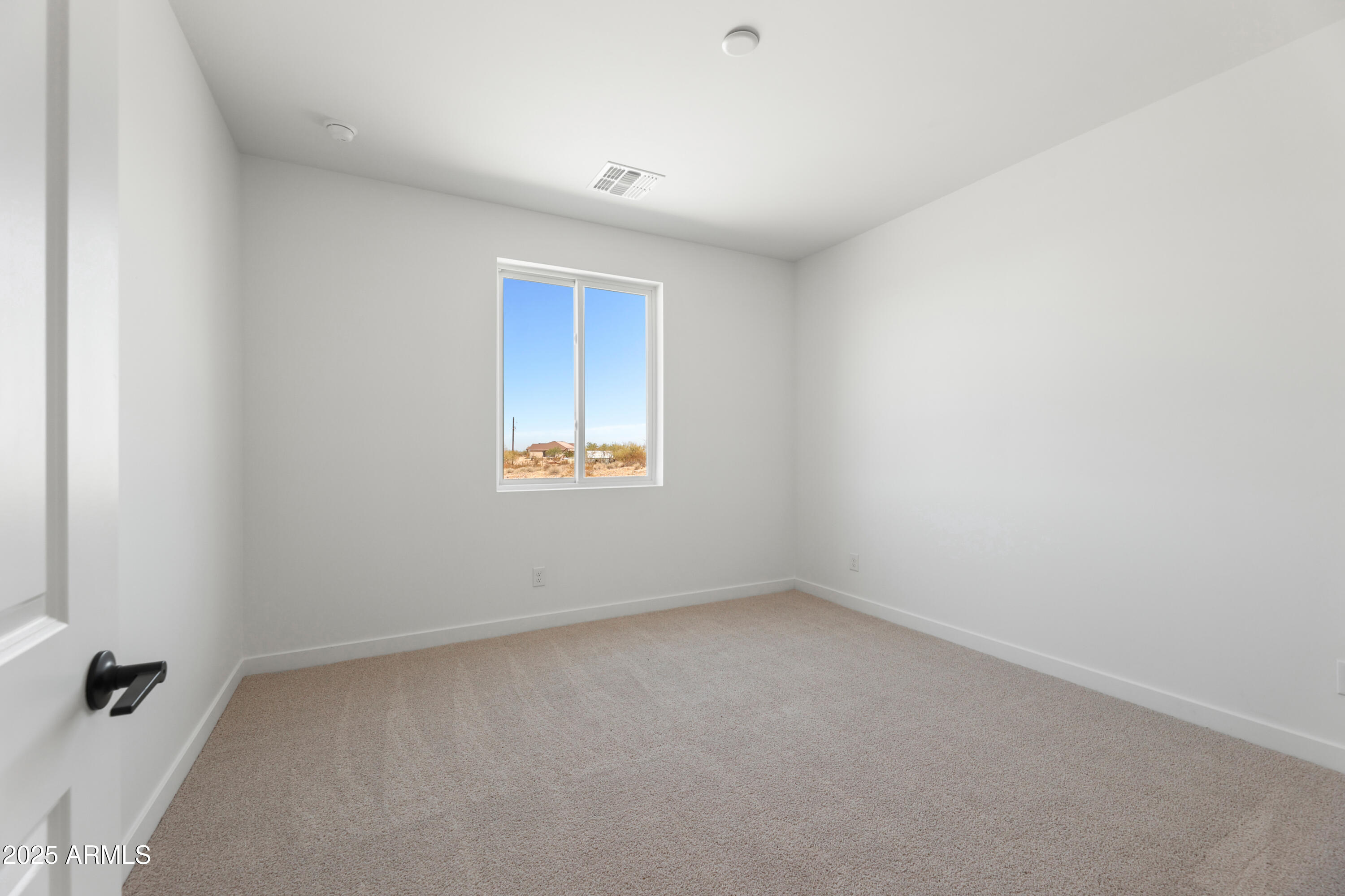 22750 East Roper Lane Florence, AZ 85132 - Photo 19 of 29 a view of an empty room with a window