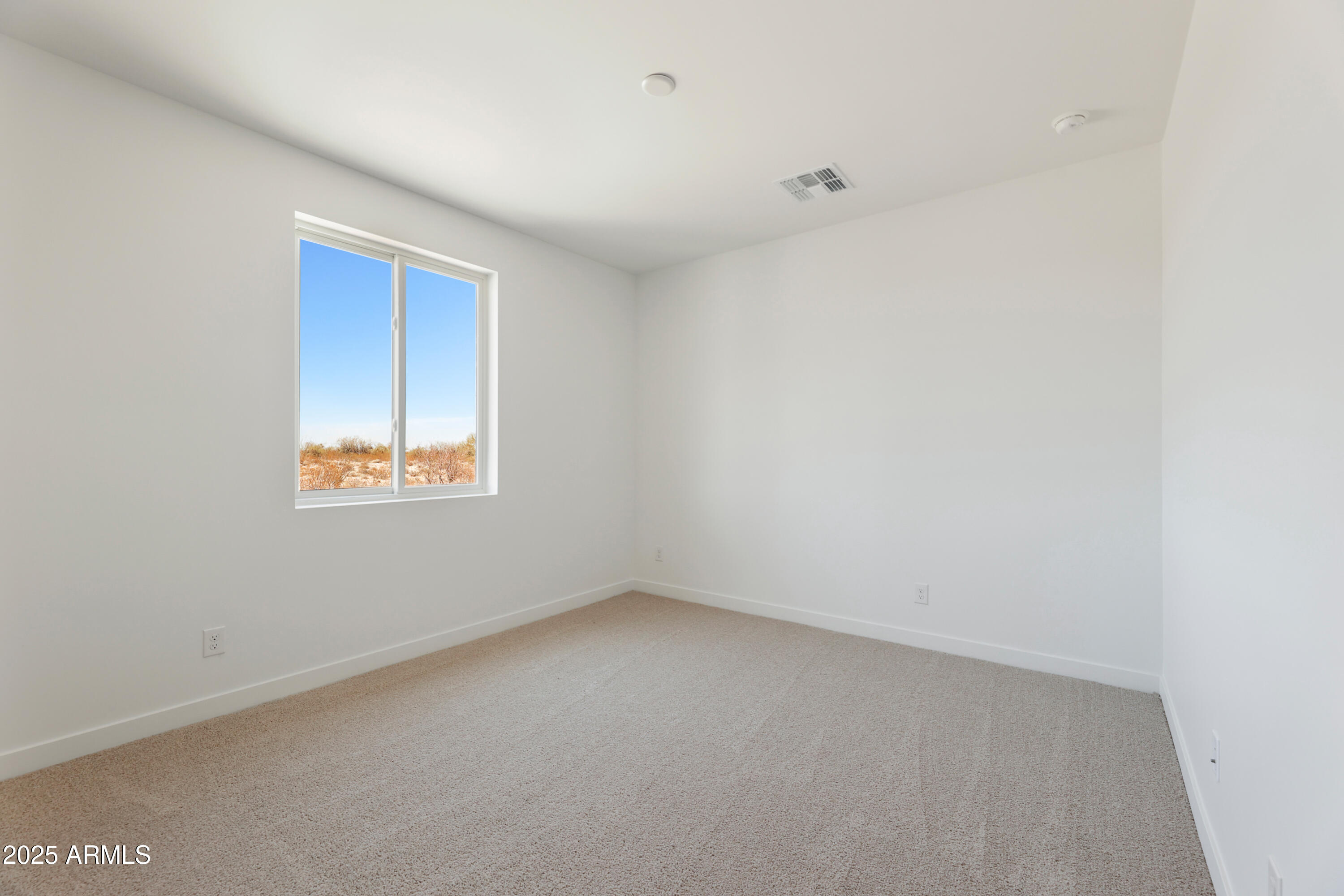 22750 East Roper Lane Florence, AZ 85132 - Photo 20 of 29 a view of an empty room with a window