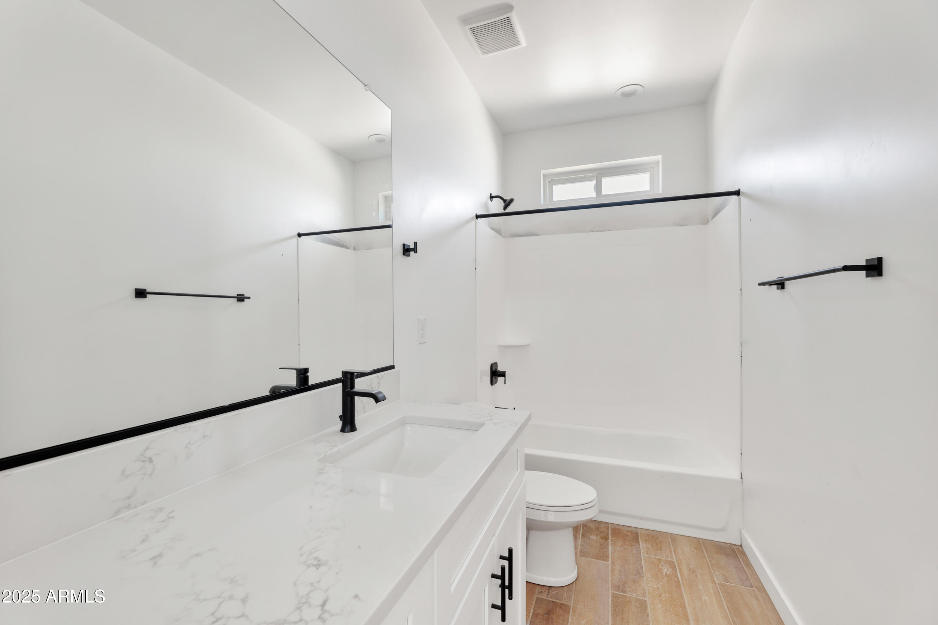 22750 East Roper Lane Florence, AZ 85132 - Photo 21 of 29 a bathroom with a sink a toilet a vanity and shower