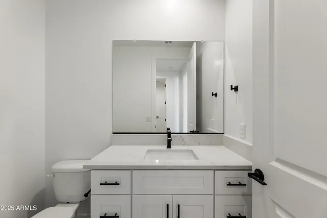 a bathroom with a sink and mirror