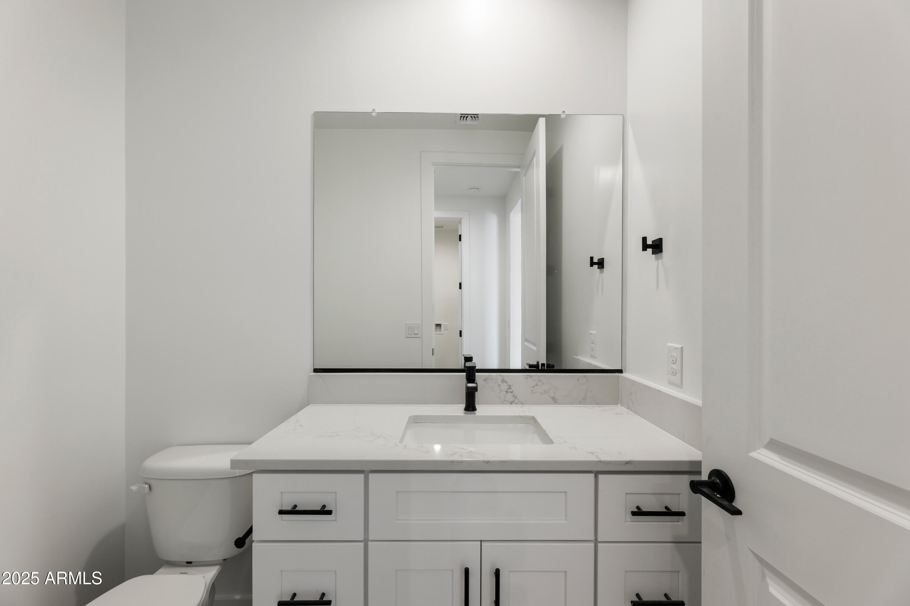 22750 East Roper Lane Florence, AZ 85132 - Photo 22 of 29 a bathroom with a sink and mirror