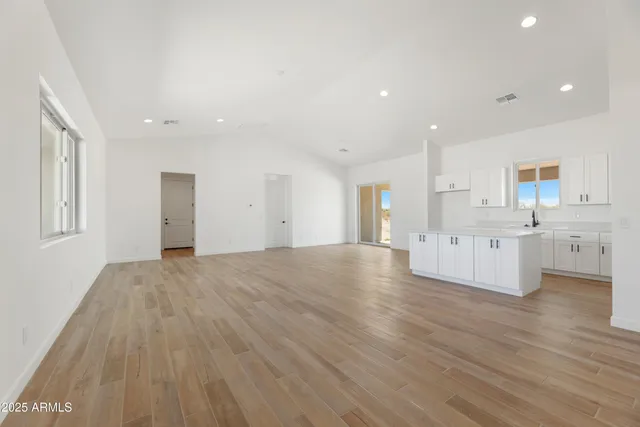 a view of kitchen with wooden floor and windows