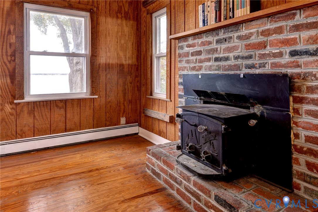 1126 Cloverdale Road Laneview, VA 22504 - Photo 33 of 49 a room with wooden floor and a window