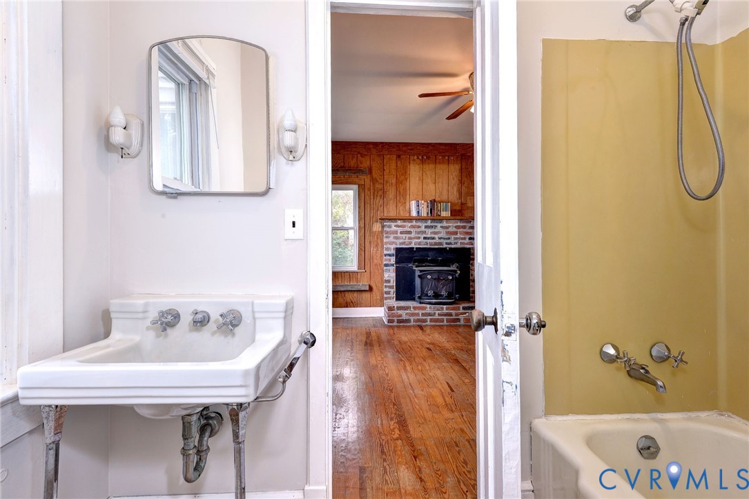 1126 Cloverdale Road Laneview, VA 22504 - Photo 35 of 49 a bathroom with a tub sink and mirror