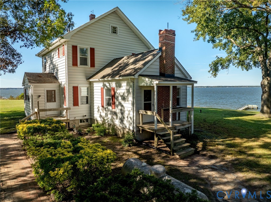 1126 Cloverdale Road Laneview, VA 22504 - Photo 44 of 49 a front view of a house with garden