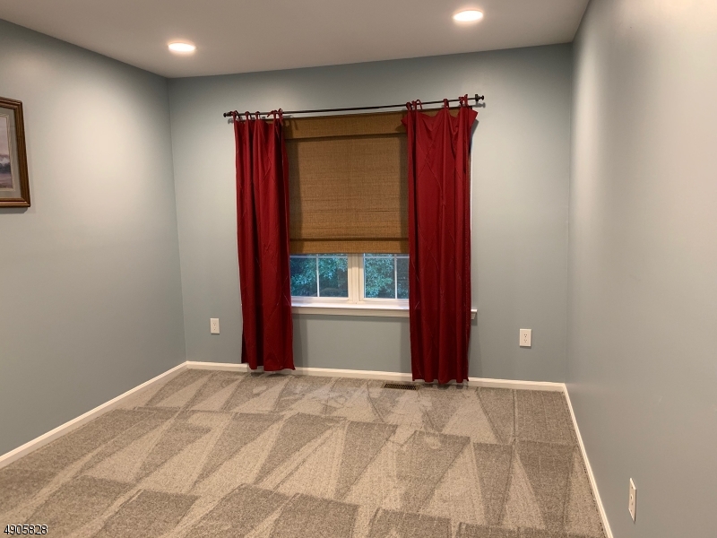 105 Well Sweep Road, Unit 105 Whitehouse Station, NJ 08889 - Photo 12 of 22 a view of a room with a large window
