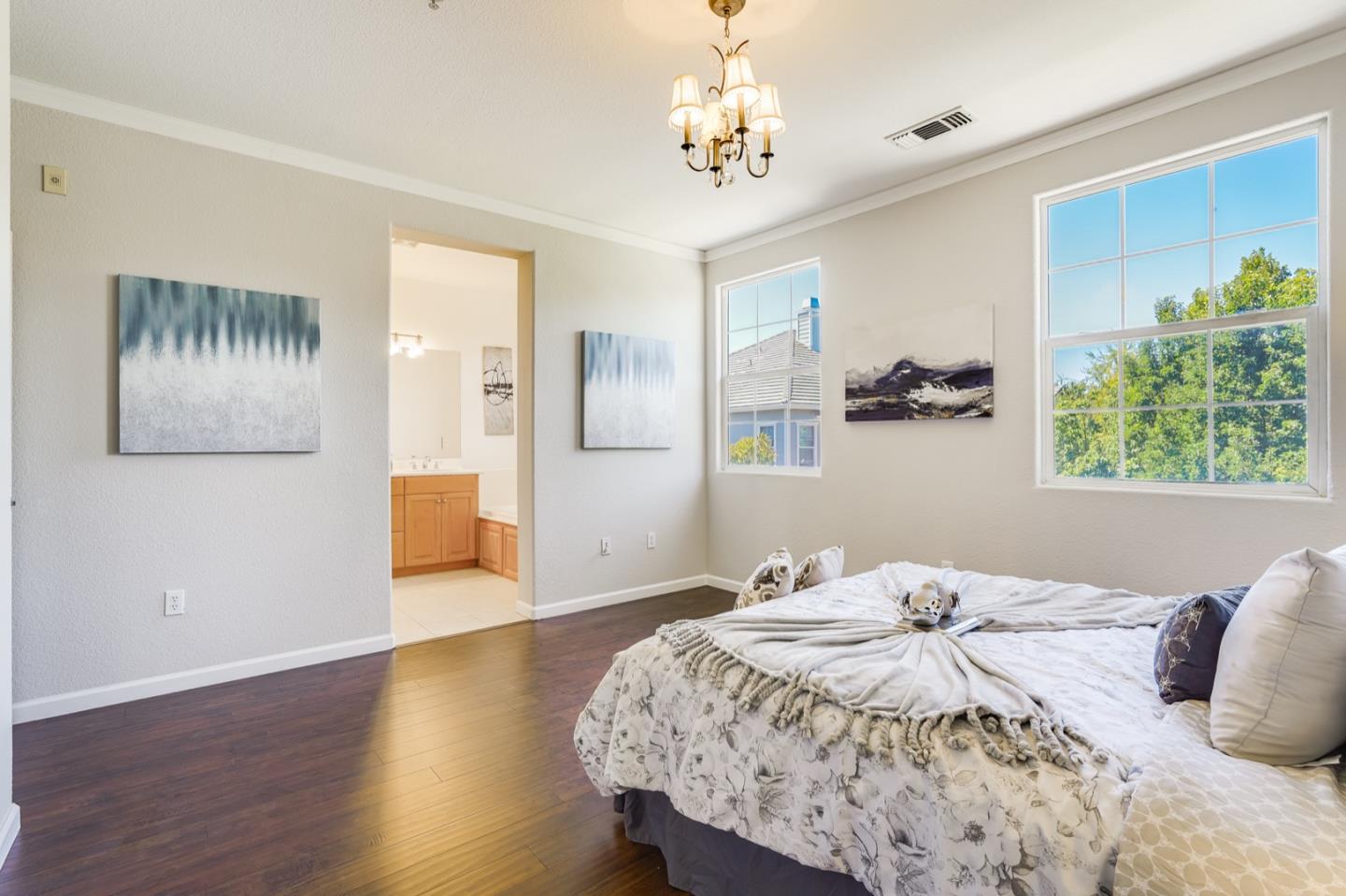 1812 Nancy Lane San Ramon, CA 94582 - Photo 26 of 69 a bedroom with a large bed and a chandelier