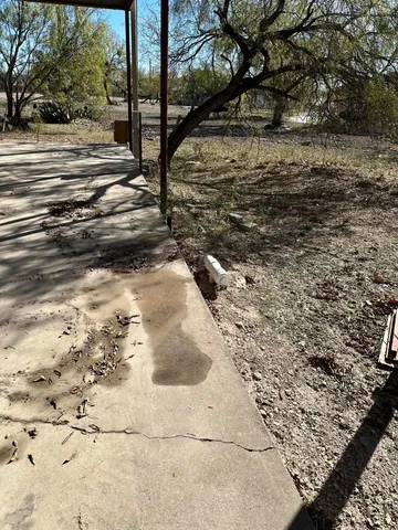 a view of a yard with an outdoor space