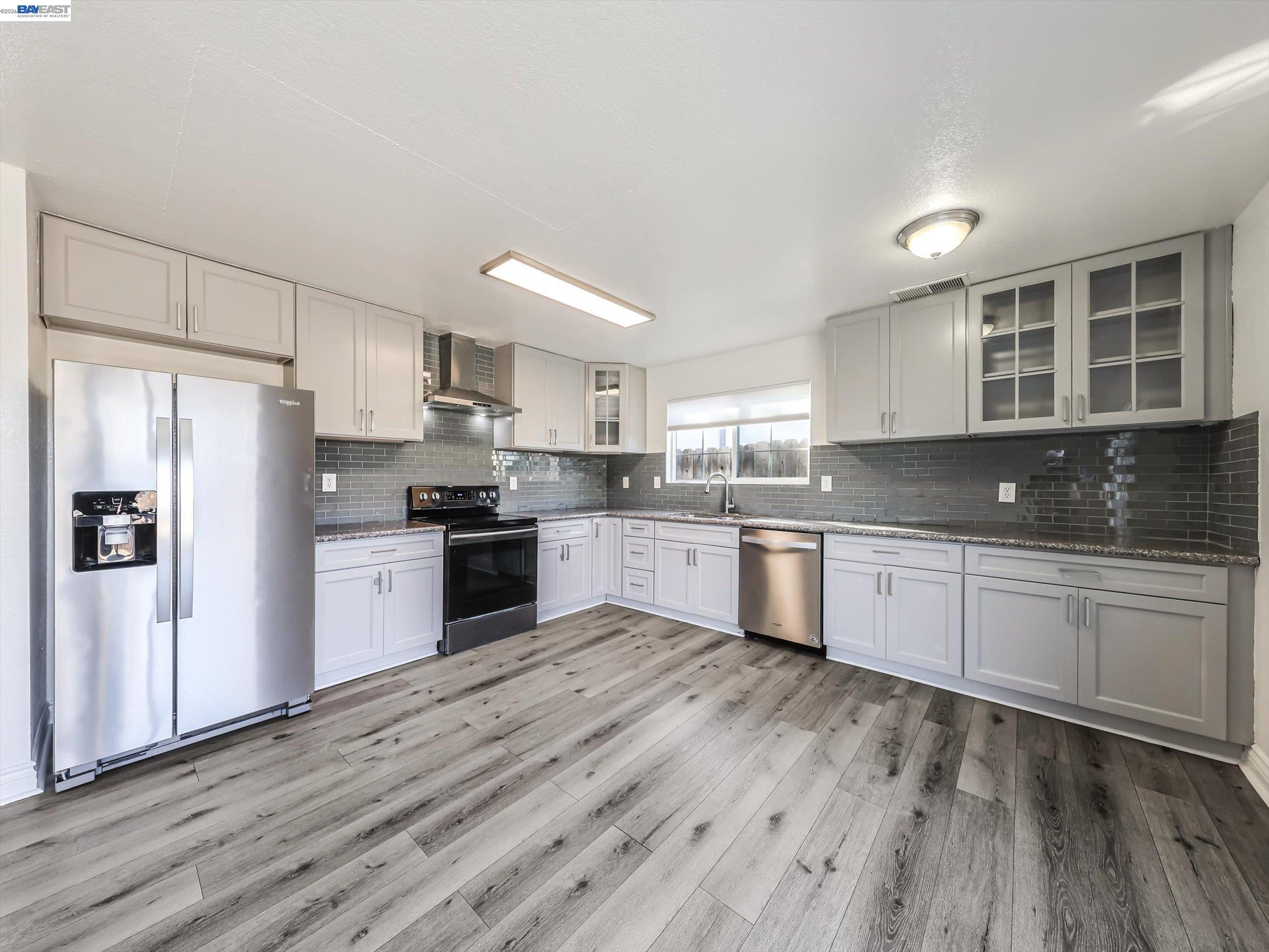 3432 Danielle Place Bay Point, CA 94565 - Photo 11 of 36 a kitchen with granite countertop stainless steel appliances refrigerator sink and cabinets