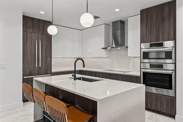 a bedroom with a bed and a night stand