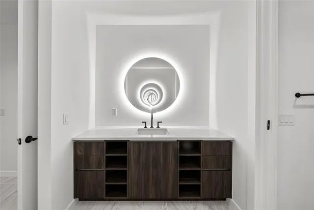 a bedroom with a bed and a walk in closet