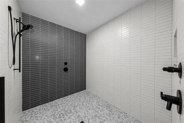 a living room with furniture and a air conditioner vent