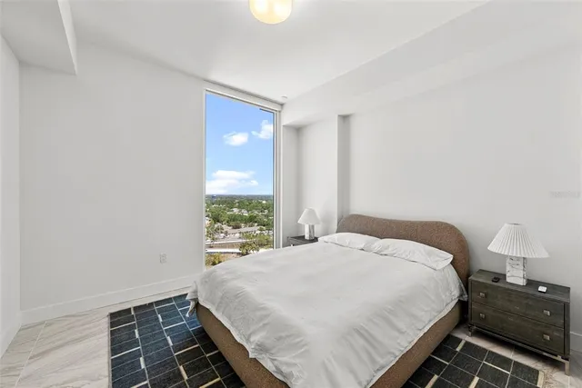 a view of a patio with couches table and chairs with wooden floor and plants