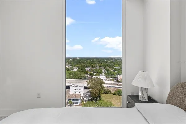 a view of a patio with table and chairs with wooden floor and plants