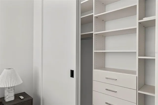 a bedroom with furniture and window