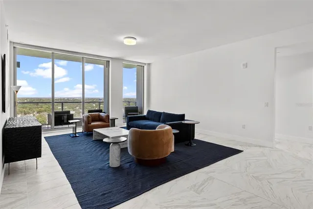 a kitchen with stainless steel appliances a sink and a refrigerator