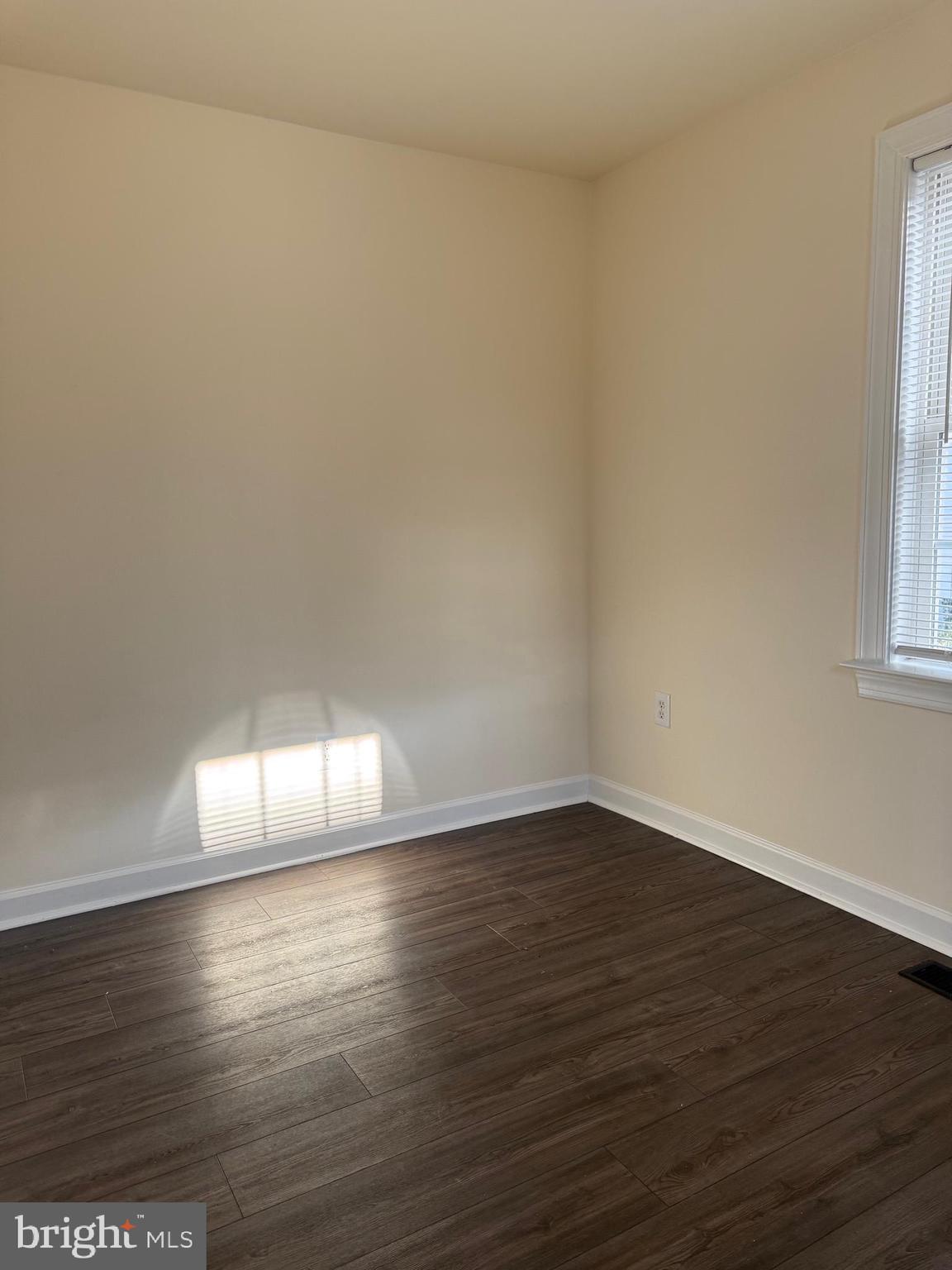 405 1/2 Elm Street Winchester, VA 22601 - Photo 16 of 16 a view of empty room with wooden floor and fan
