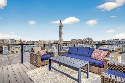 a sitting area with furniture and city view