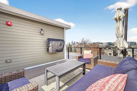 a view of a terrace with furniture