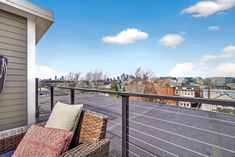 a view of a balcony with furniture