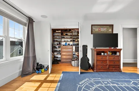 a view of a livingroom with furniture and an empty room