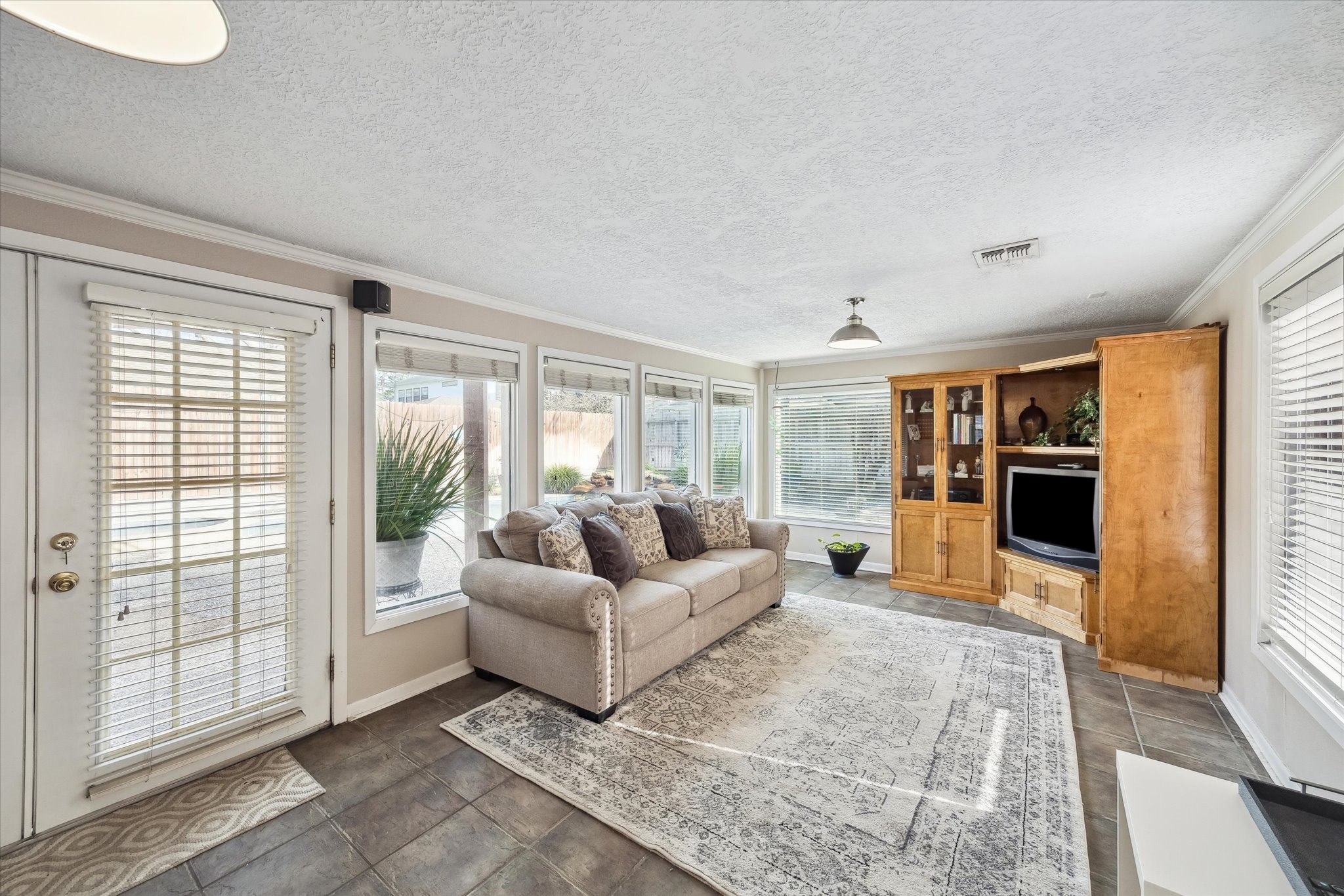 1423 Richelieu Lane Houston, TX 77018 - Photo 12 of 46 a living room with furniture and large windows