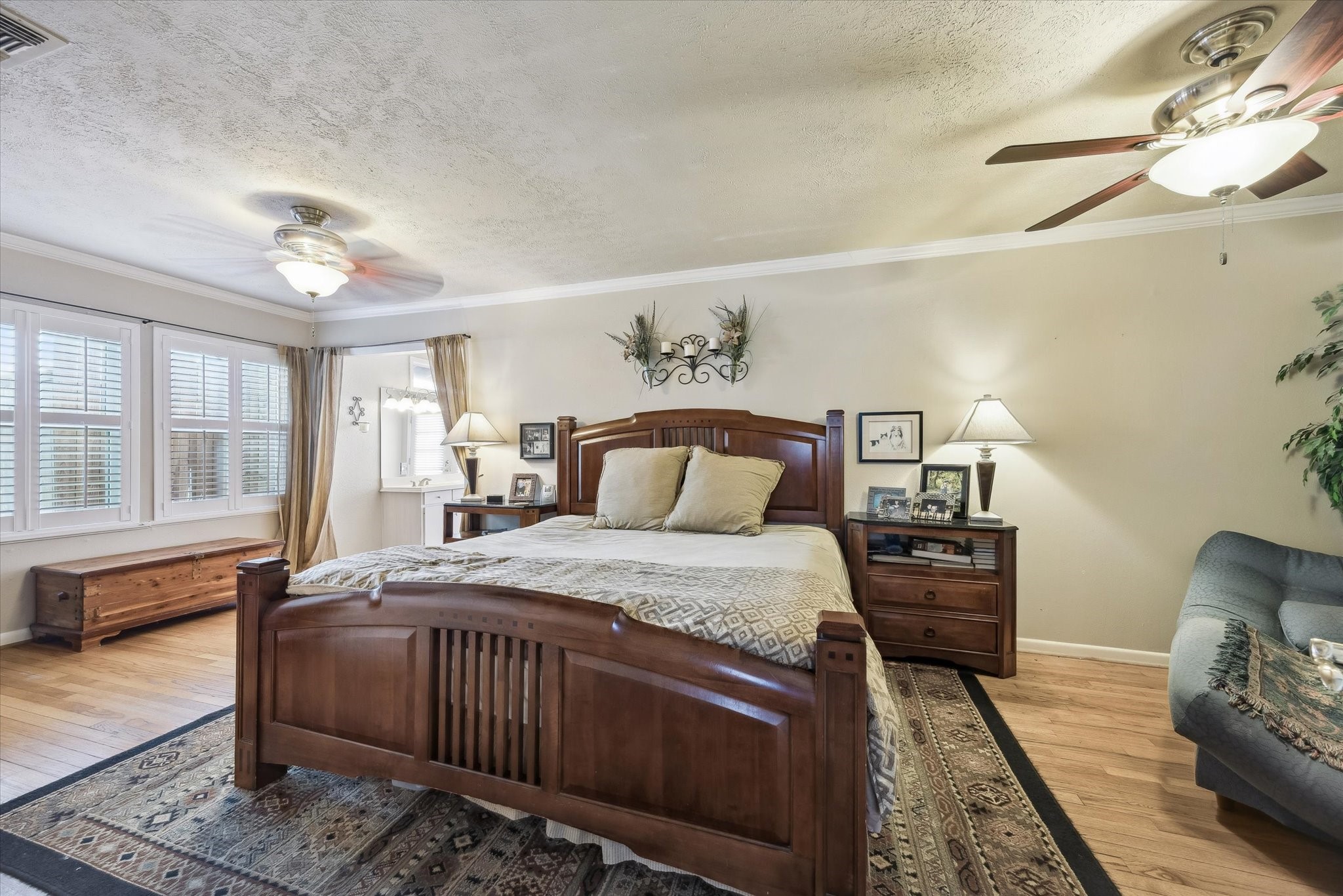 1423 Richelieu Lane Houston, TX 77018 - Photo 13 of 46 a bedroom with a bed and wooden floor
