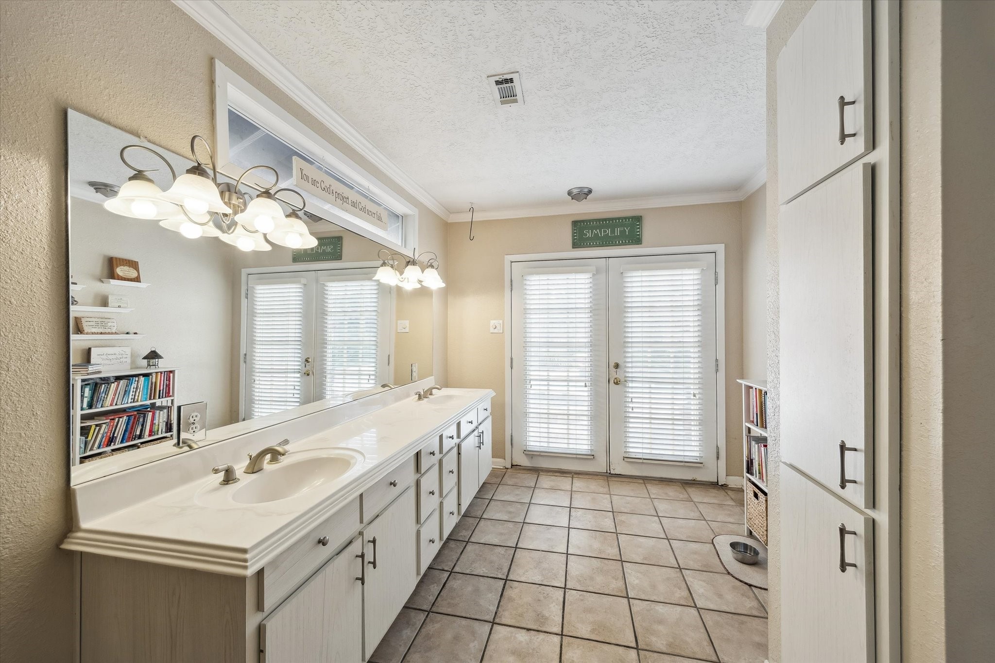 1423 Richelieu Lane Houston, TX 77018 - Photo 15 of 46 a bathroom with a sink a large mirror and a shower