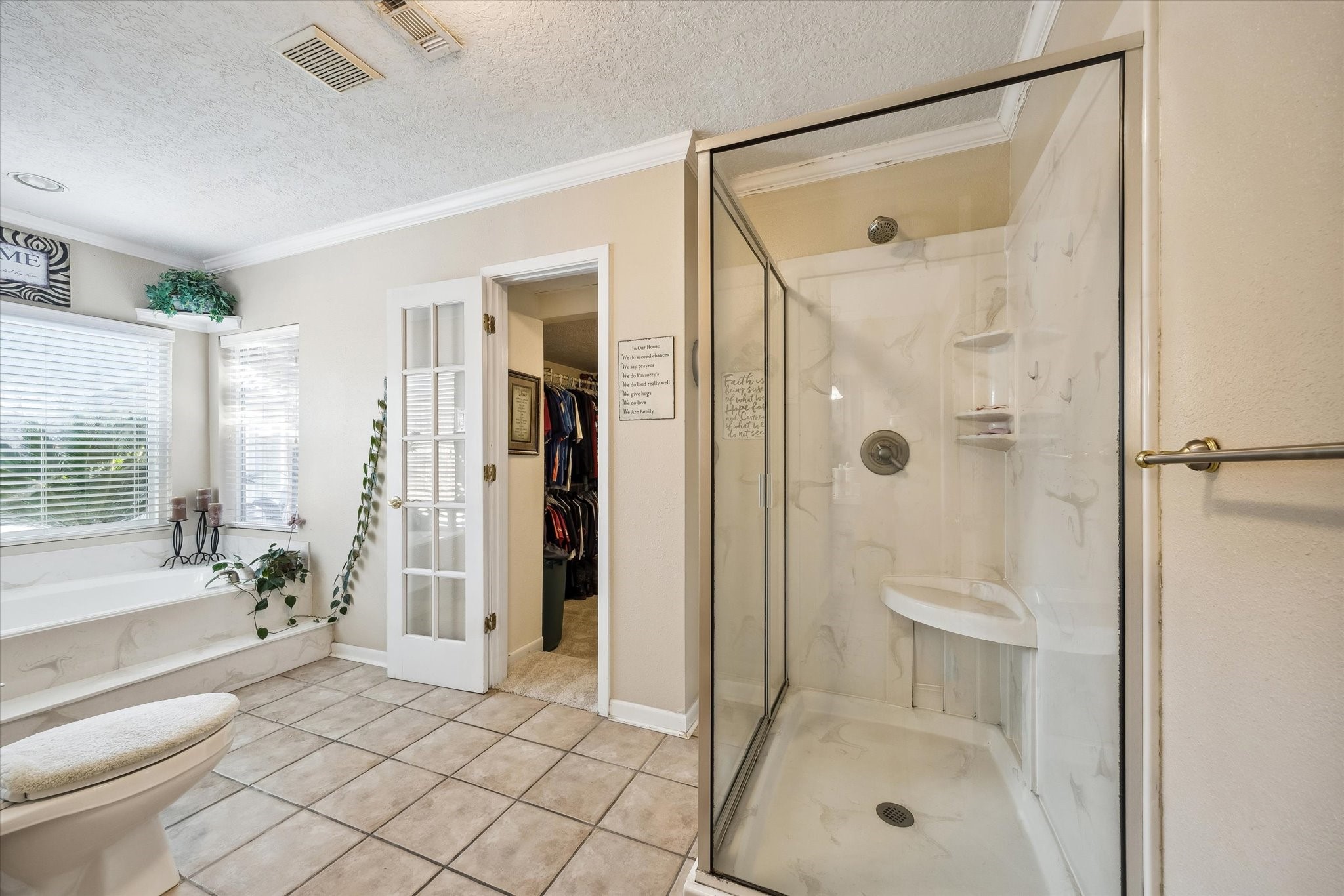 1423 Richelieu Lane Houston, TX 77018 - Photo 16 of 46 a bathroom with a tub shower and a sink