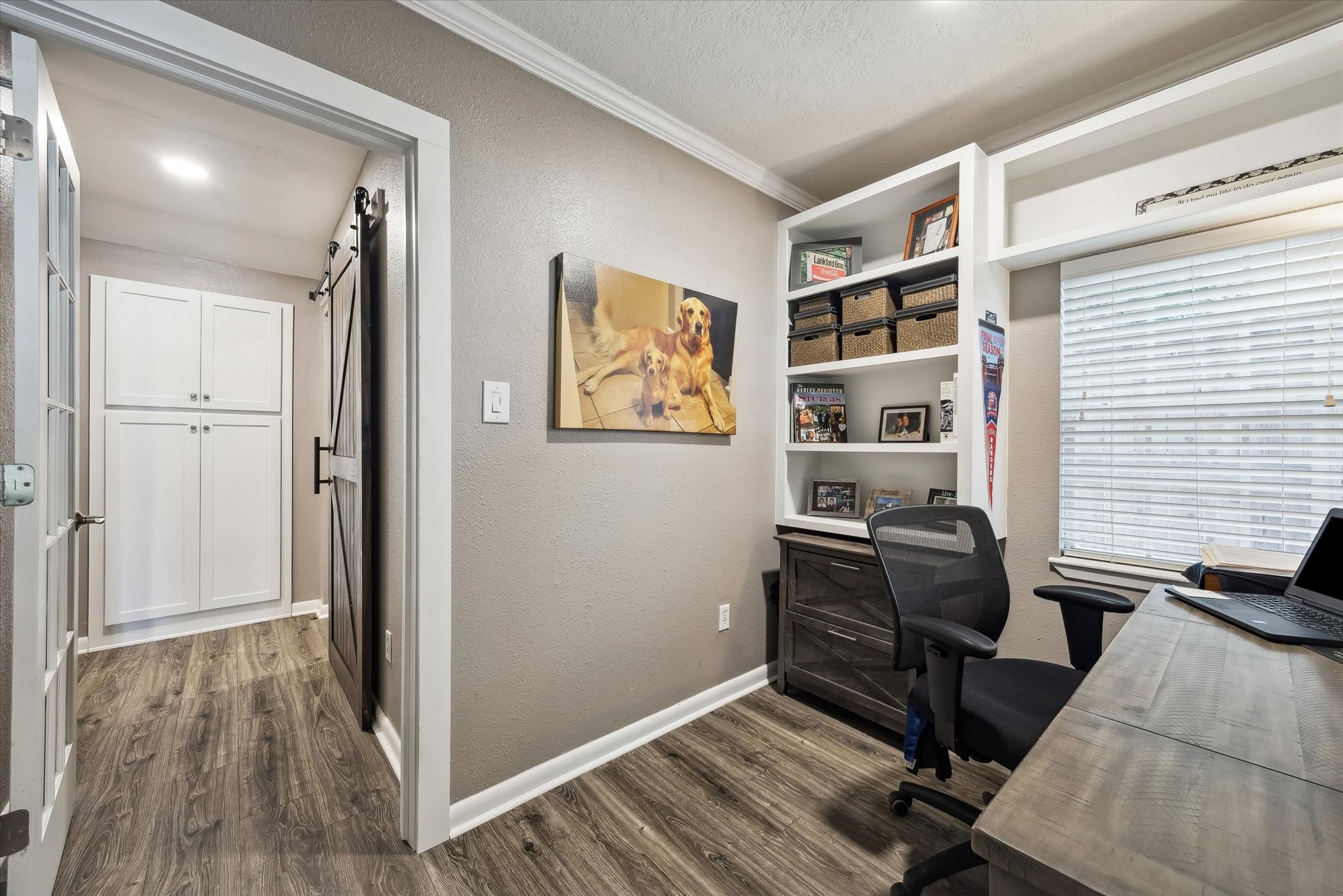 1423 Richelieu Lane Houston, TX 77018 - Photo 22 of 46 a view of a workspace with furniture and wooden floor