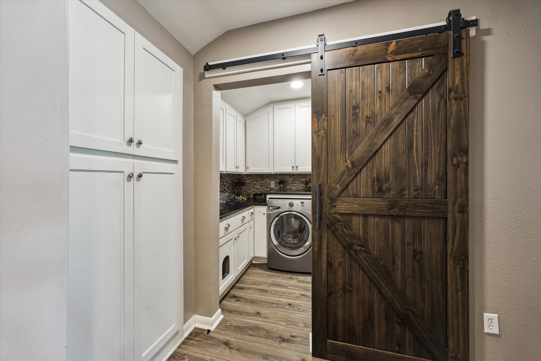 1423 Richelieu Lane Houston, TX 77018 - Photo 24 of 46 a view of walk in closet with clothes and shoes