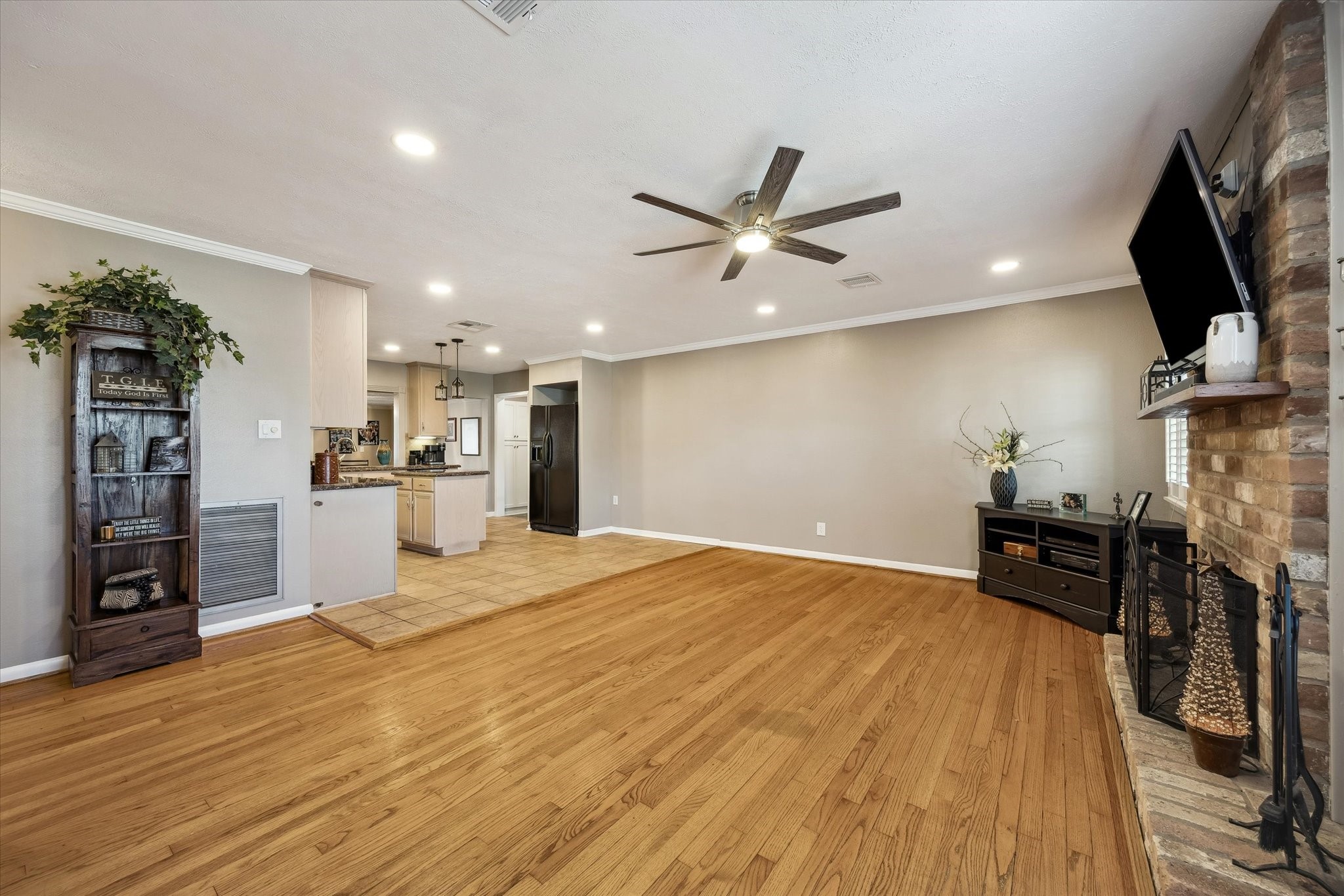 1423 Richelieu Lane Houston, TX 77018 - Photo 6 of 46 a open kitchen with stainless steel appliances kitchen island granite countertop a refrigerator a stove a sink and a dining table with wooden floor