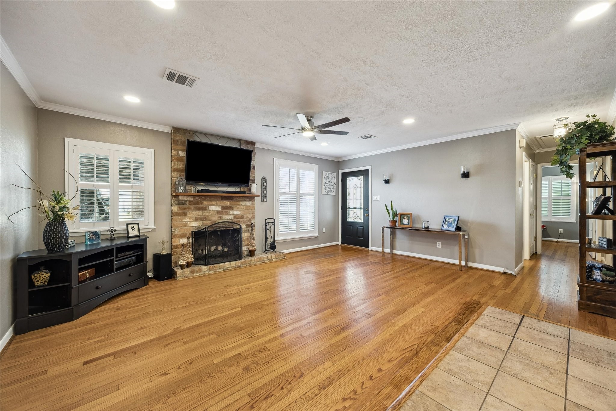 1423 Richelieu Lane Houston, TX 77018 - Photo 7 of 46 a view of a livingroom with furniture a flat screen tv and fire place