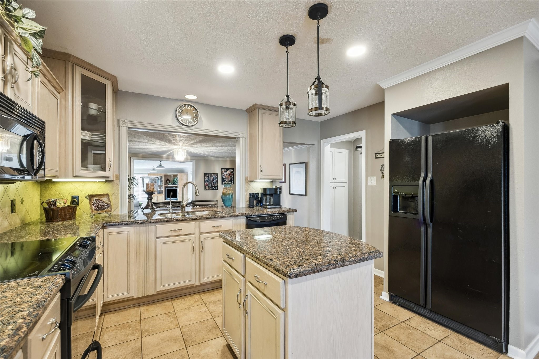 1423 Richelieu Lane Houston, TX 77018 - Photo 9 of 46 a kitchen with a refrigerator a sink dishwasher a stove and a dining table with wooden floor