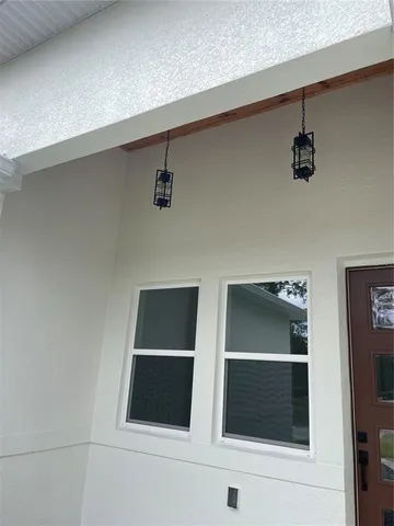 a kitchen with stainless steel appliances white cabinets sink and a refrigerator