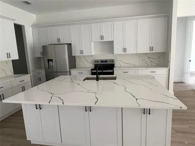 a view of empty room with wooden floor and sliding door