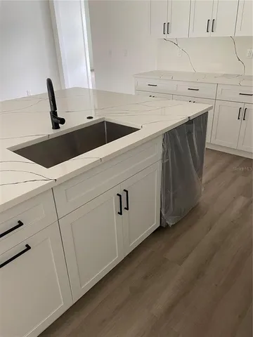 a view of a porch with wooden floor and outdoor space