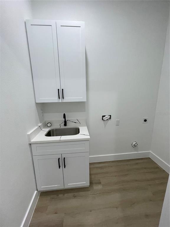 41719 Aspen Street Eustis, FL 32736 - Photo 20 of 52 a room with a sink and cabinets