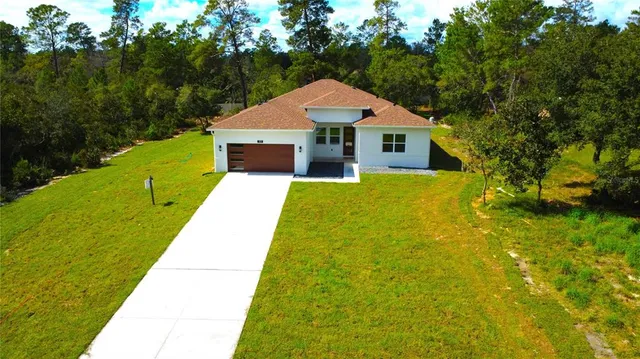 a view of house with garden
