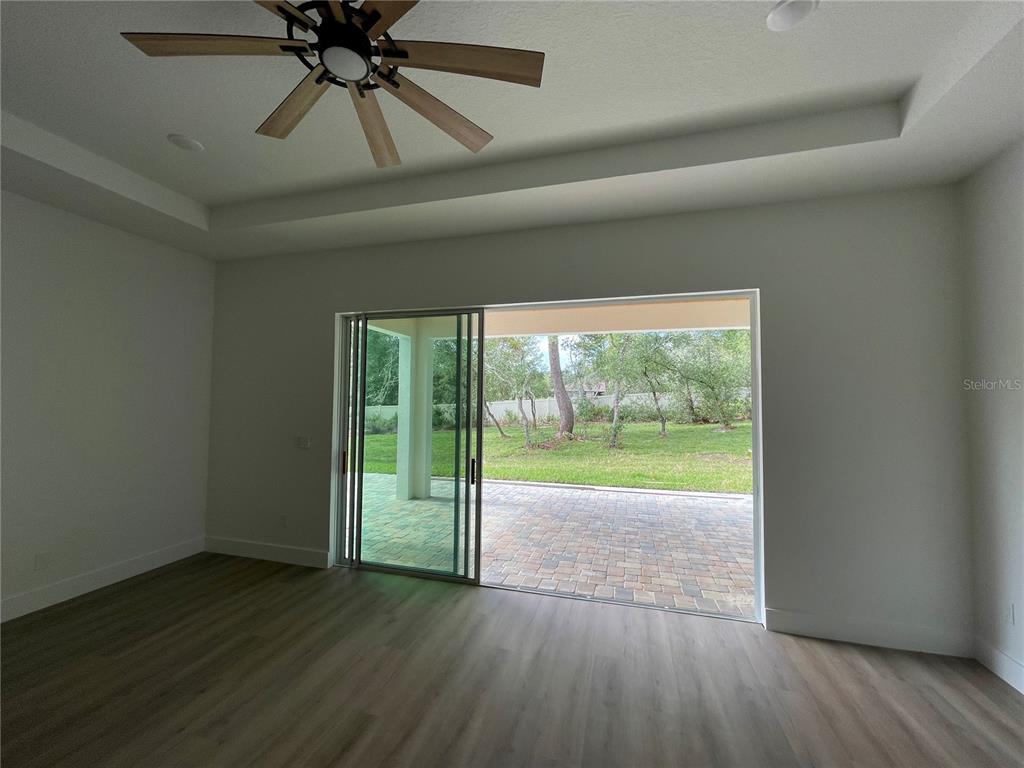 41719 Aspen Street Eustis, FL 32736 - Photo 23 of 52 wooden floor in an empty room with a window