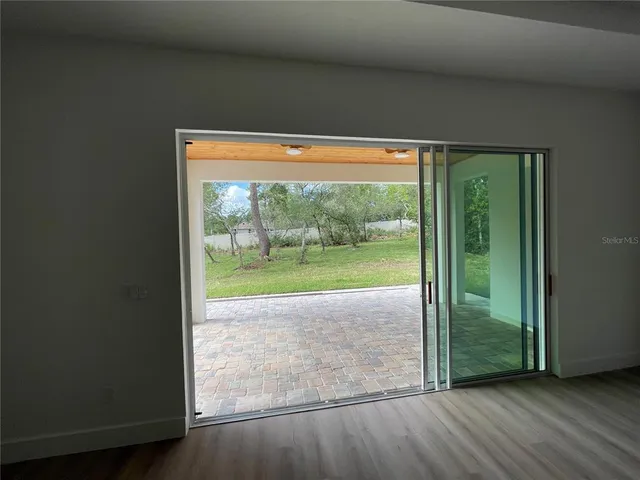 a view of a porch and garden