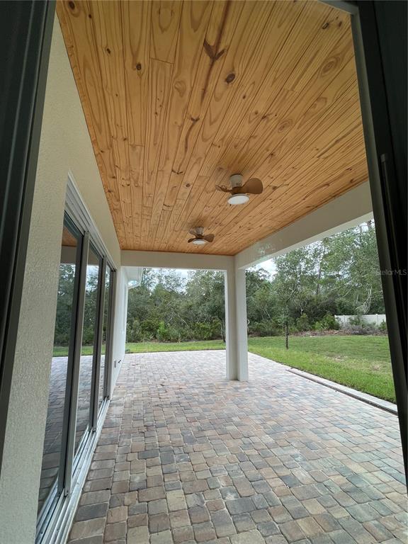41719 Aspen Street Eustis, FL 32736 - Photo 34 of 52 a view of a porch and garden
